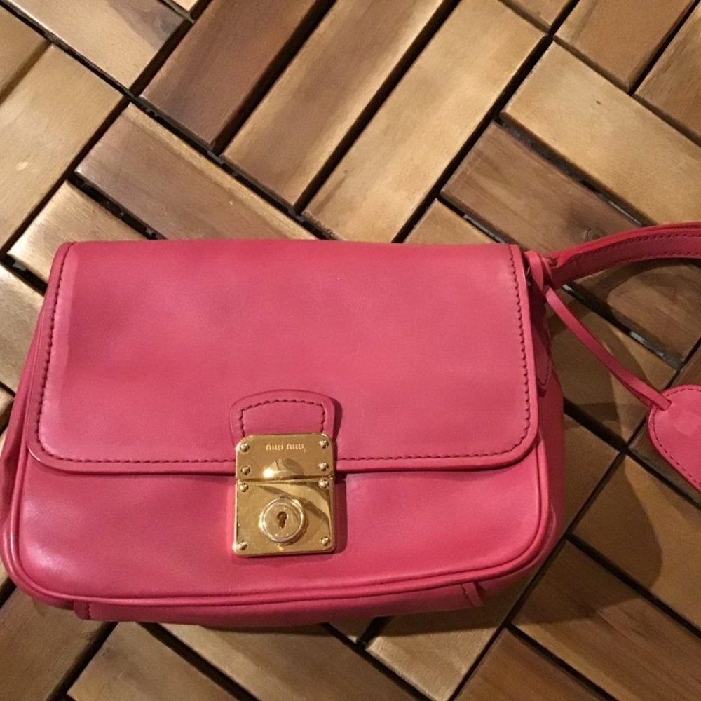 Miu Miu Miu clutch smooth antique leather deliberately stained to look old